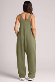 Relaxed fit pocketed tank jumpsuit in Matcha Green with wide legs and side pockets.