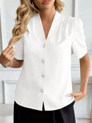 White V-neck short sleeve shirt with pearl button details and puff sleeves.