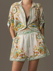 Bohemian print two-piece set with buttoned shirt and high-waisted shorts.
