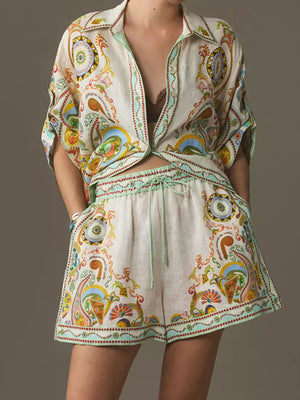 Bohemian print two-piece set with buttoned shirt and high-waisted shorts.