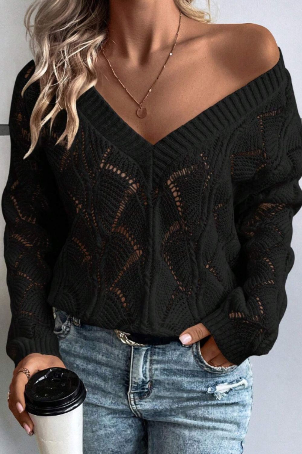 Black openwork knit v-neck pullover sweater with diamond pattern detail.