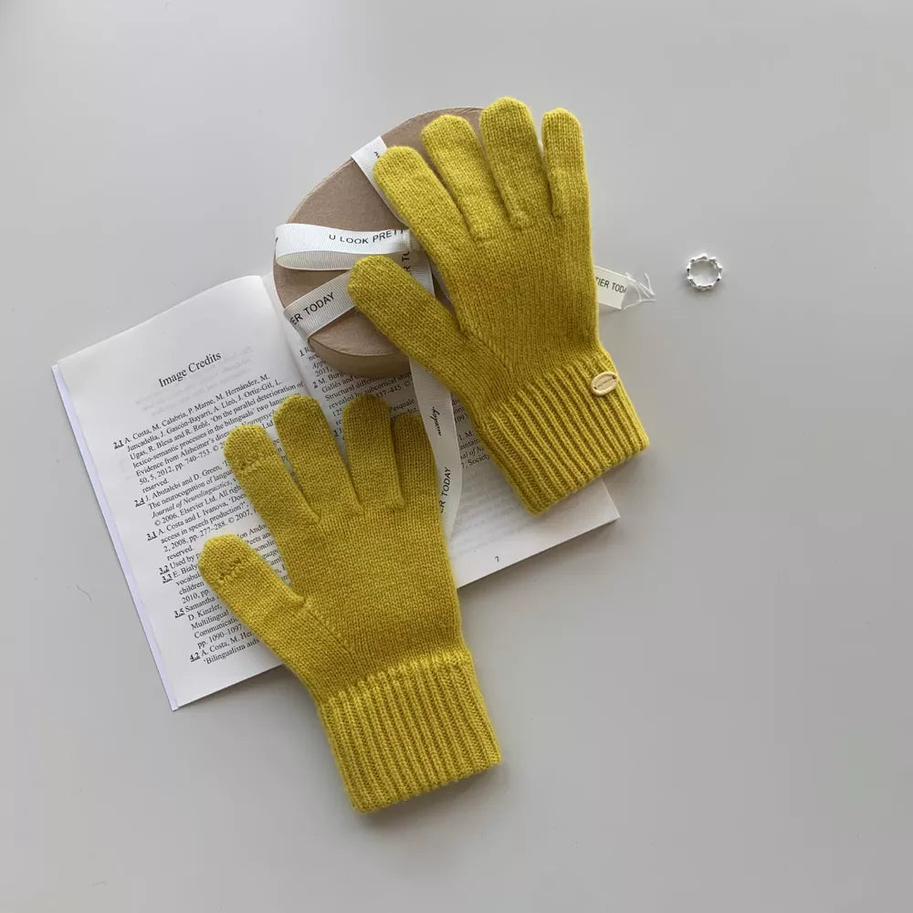 Mustard wool knit gloves with ribbed cuffs and button detail.