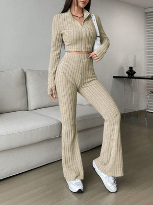 Khaki ribbed knit flare co-ord set with zip-neck crop top and bell bottom pants.