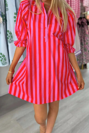 Charming ruffled mini dress with puff sleeves in bold red and pink stripes, button-down, A-line cut.