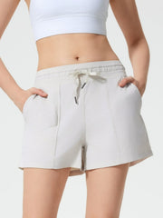 Coastal drawstring utility shorts in light gray with elastic waistband and pockets.