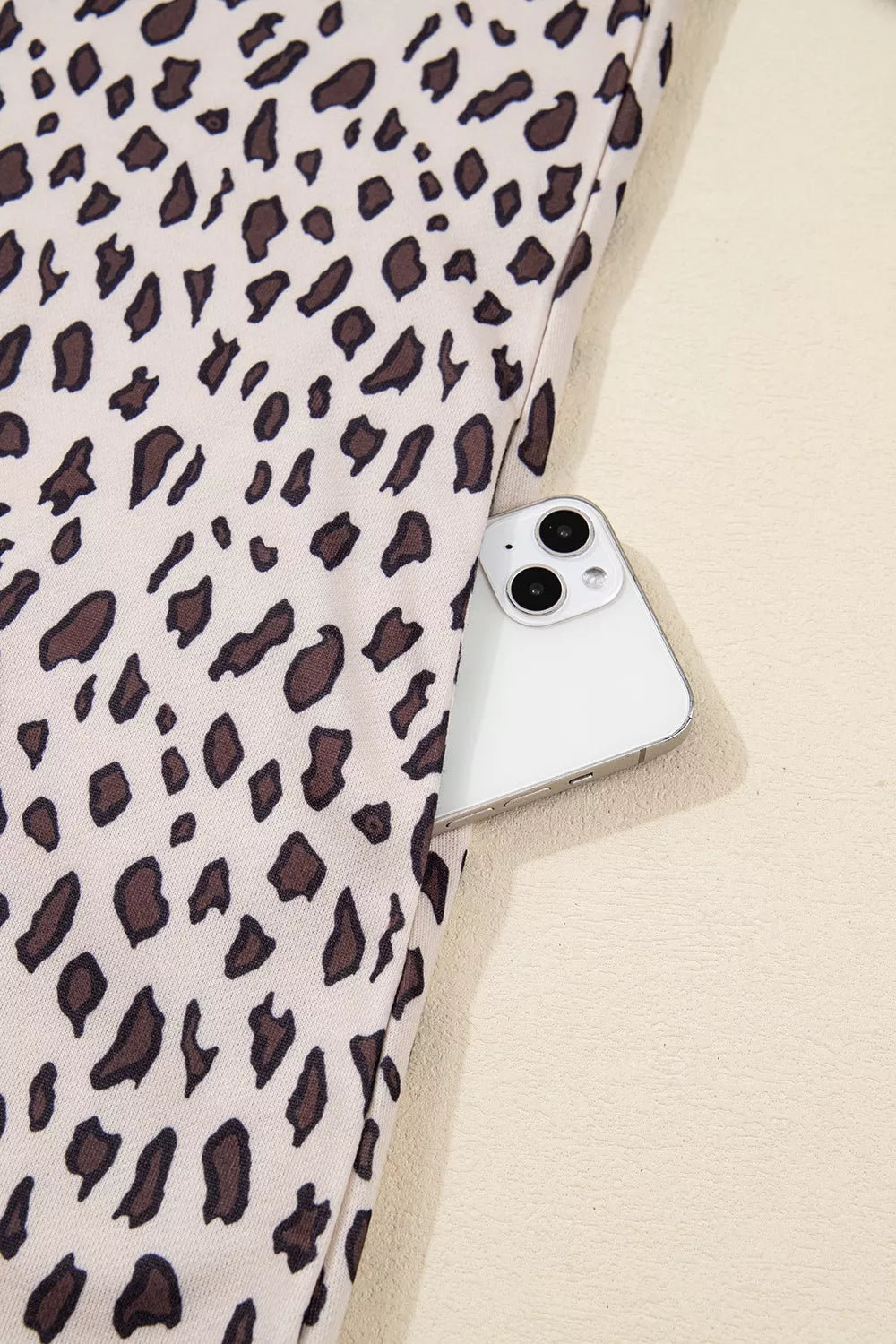 Leopard print cotton mini dress with a zip-up collar and side pocket detail.