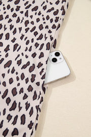 Leopard print cotton mini dress with a zip-up collar and side pocket detail.