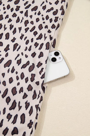 Leopard print cotton mini dress with a zip-up collar and side pocket detail.