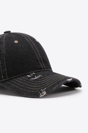 Black distressed baseball cap with contrast stitching and frayed details.