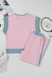 Ribbed blush pink loungewear set with colorblock trim and blue waistband.