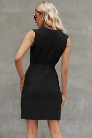 Black belted knit tank dress with a textured weave and A-line skirt.