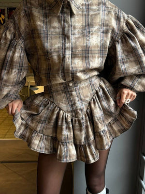 Plaid puff sleeve shirt and ruffled hem skirt set in beige.