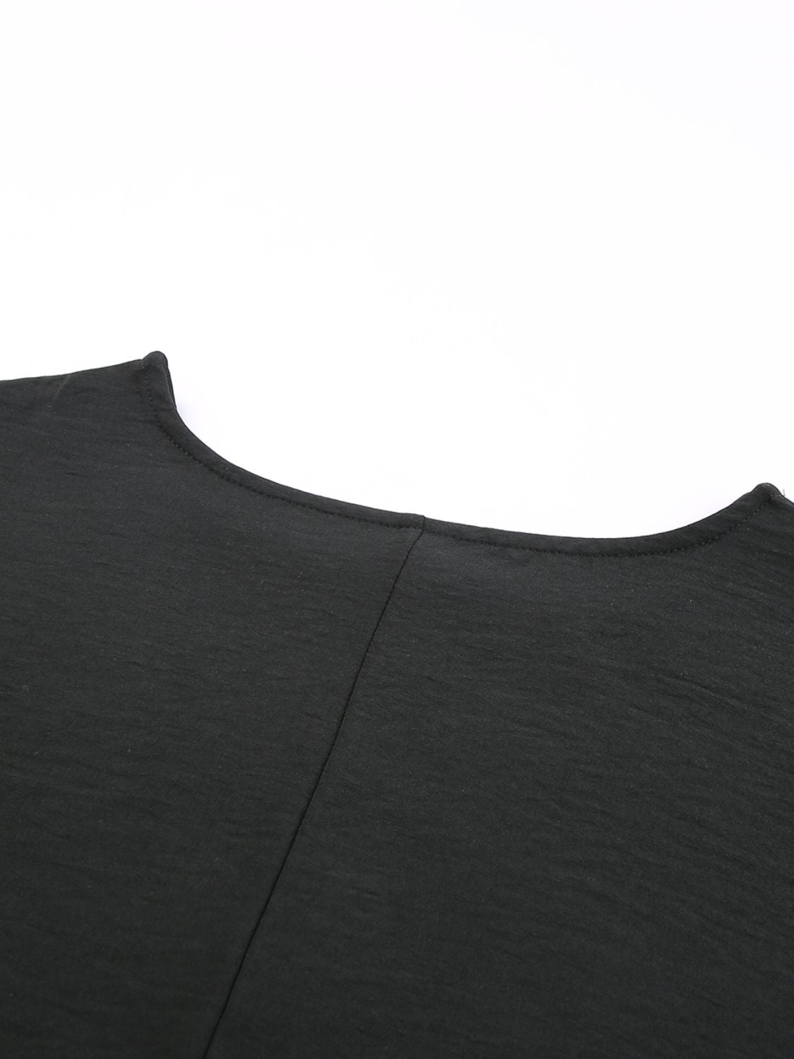 Black textured blouse with crew neck and seam detail
