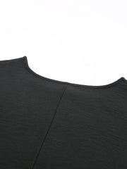 Black textured blouse with crew neck and seam detail