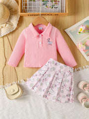 Pink ribbed polo with duck embroidery and pleated duck print skirt set