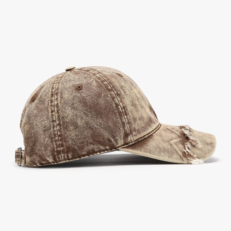 Tan acid wash distressed baseball cap with frayed brim detail.