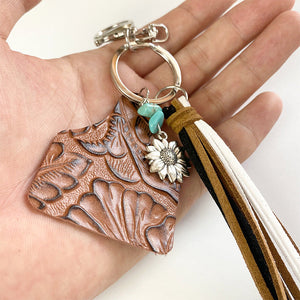 Leopard print tag charm keychain with turquoise beads, sunflower charm, and multi-color tassels.