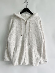White speckled knit relaxed zip-up hoodie with ring zipper and drawstring hood.