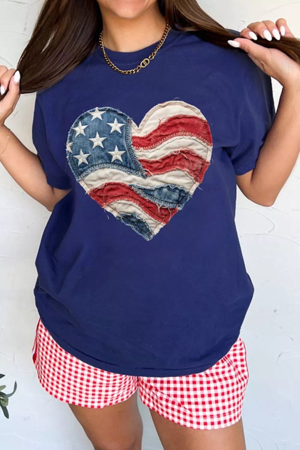 Navy cotton t-shirt with distressed American flag denim heart graphic.