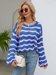 Blue and pink striped crochet crop sweater with scalloped hem and bell sleeves.