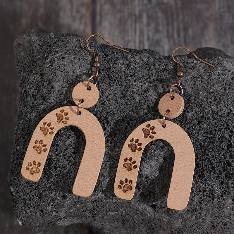 Camel paw print arch earrings with wooden material and copper hooks.