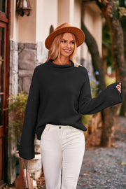 Black cuffed sleeve turtleneck knit sweater with a relaxed fit.