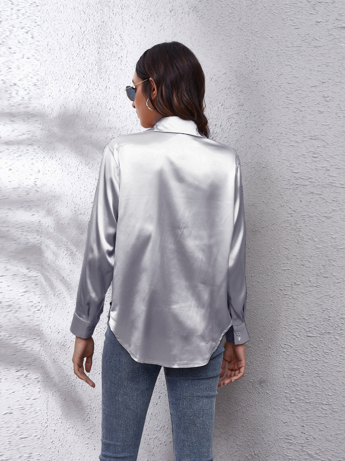 Silken button-down shirt in light gray with long sleeves and a relaxed fit.