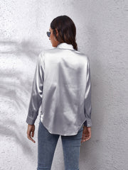 Silken button-down shirt in light gray with long sleeves and a relaxed fit.
