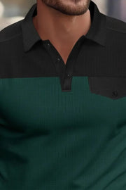 Colorblock waffle knit polo shirt in dark green and black with chest pocket detail.