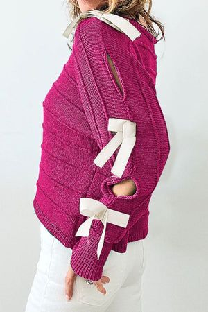 Deep Rose ribbed knit sweater with bow sleeve details and cutouts.