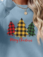 Crewneck sweatshirt in Misty Blue with plaid Christmas trees graphic and Merry Christmas text.