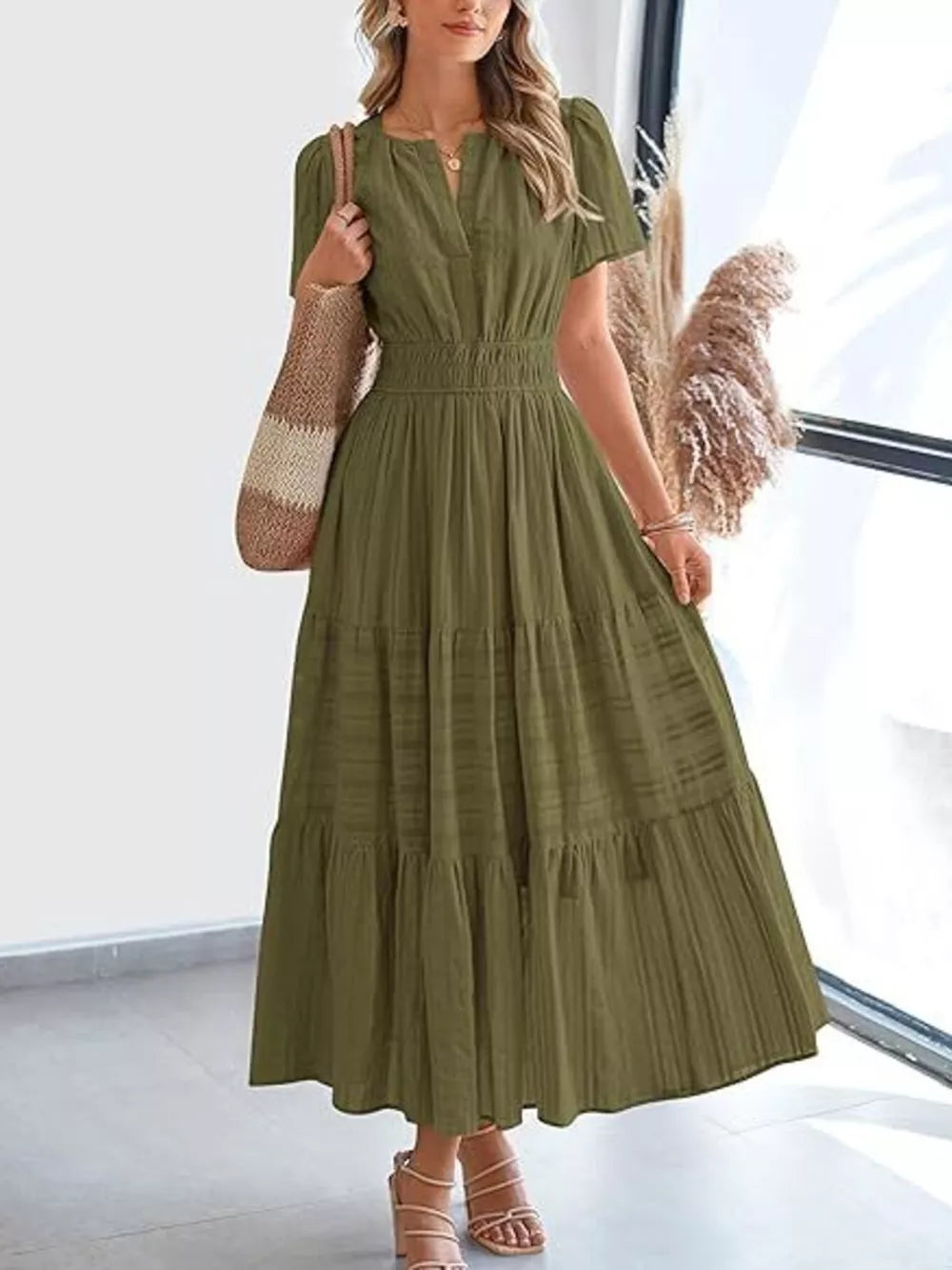 Moss V-neck tiered midi dress with smocked waist and short sleeves.