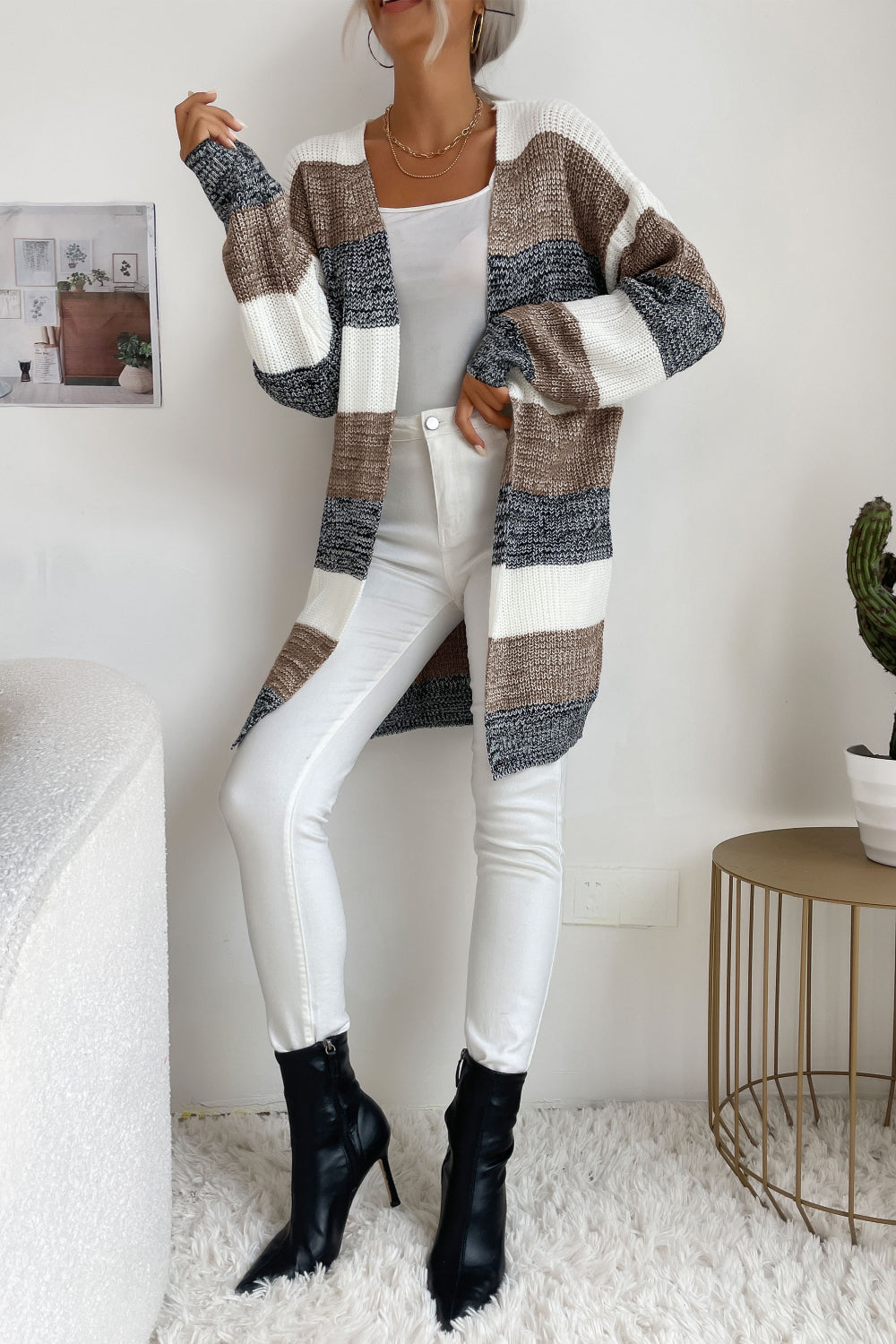Open-front knit cardigan with horizontal stripes in khaki, black, white, and dark gray.