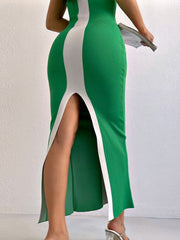Mid green bodycon maxi dress with white contrast panels and a high leg slit.