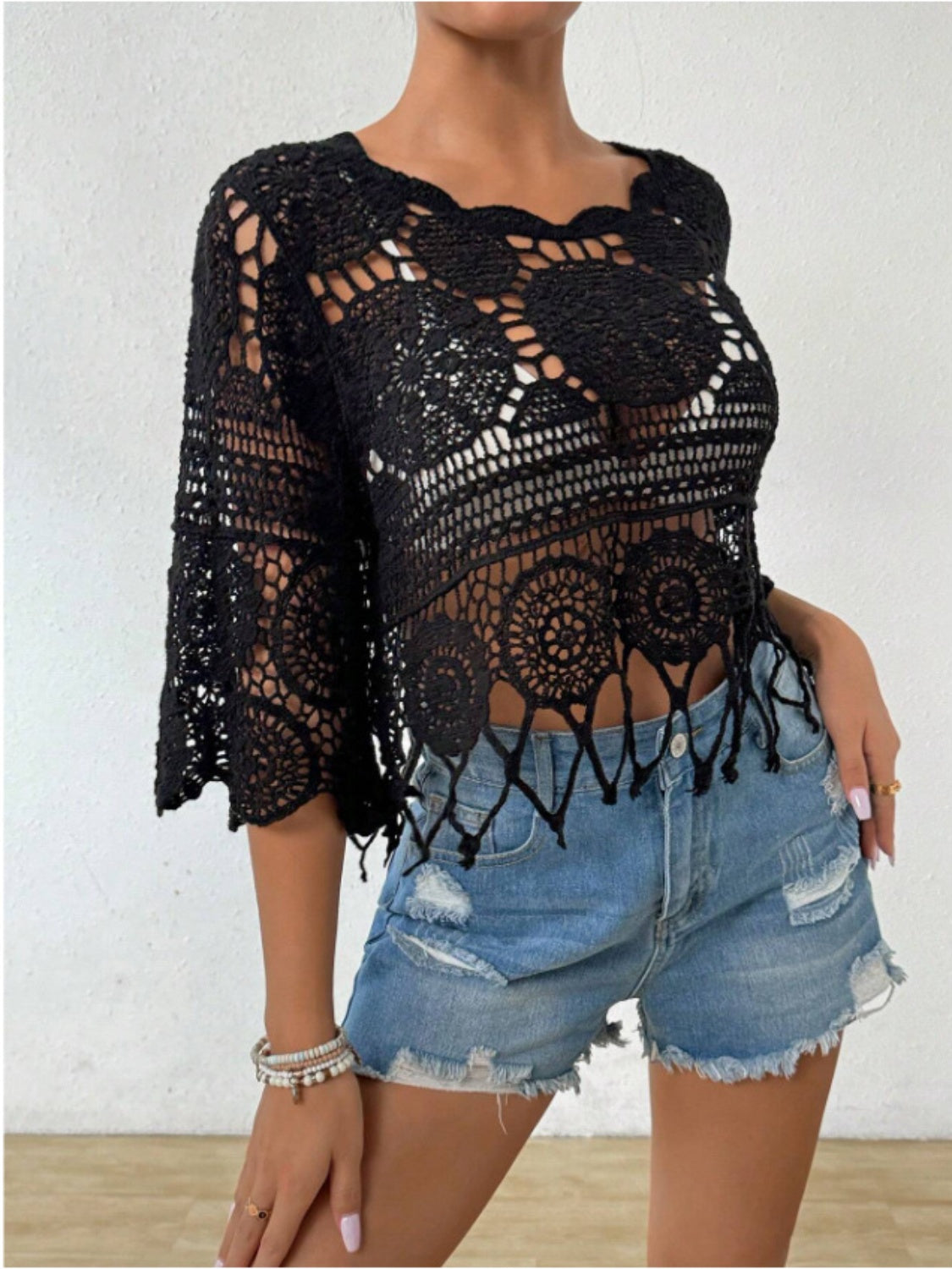 Black crochet medallion fringe top with bell sleeves and a scalloped hem.