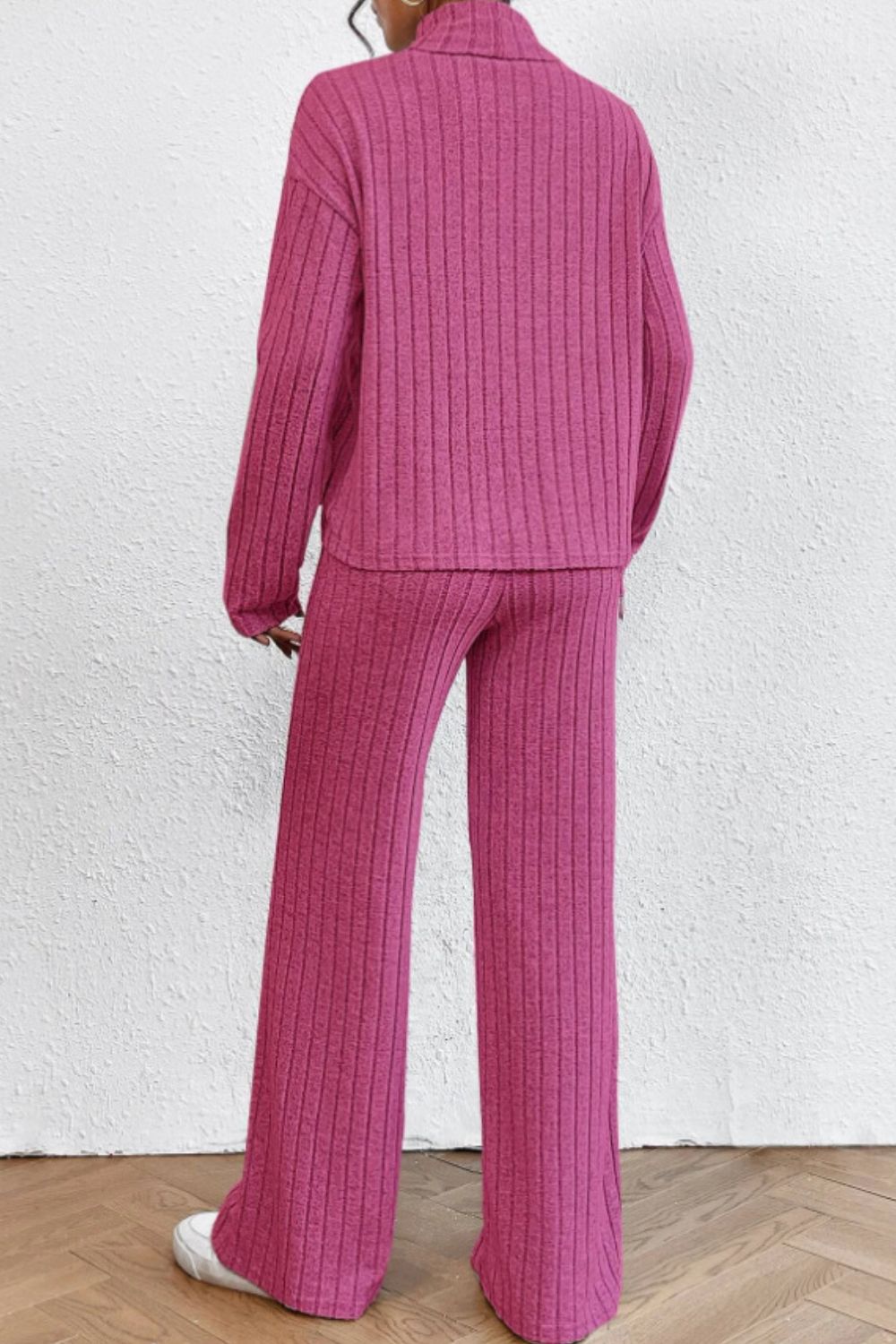 Hot Pink ribbed knit turtleneck lounge set with wide leg pants.