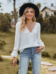 White textured blouse with lace trim V-neck and bell sleeves