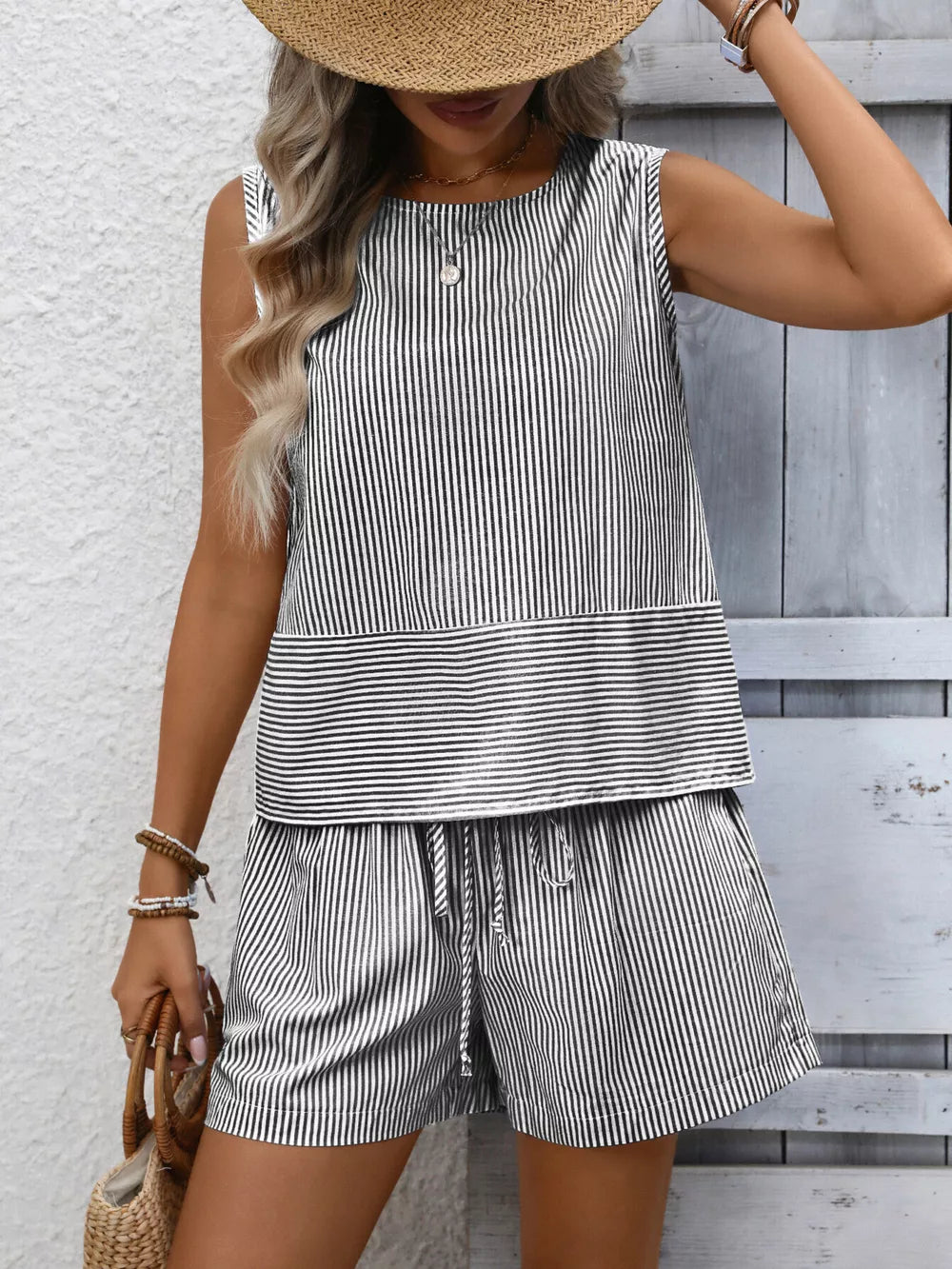 Black and white striped sleeveless top and drawstring shorts set