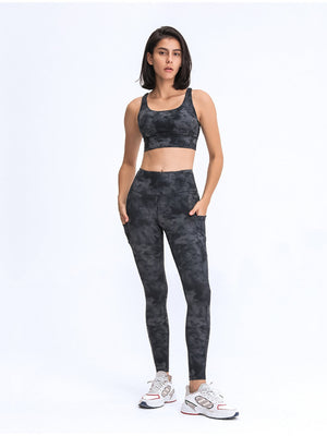 Black tie-dye sculpt leggings with performance pockets shown on a model.