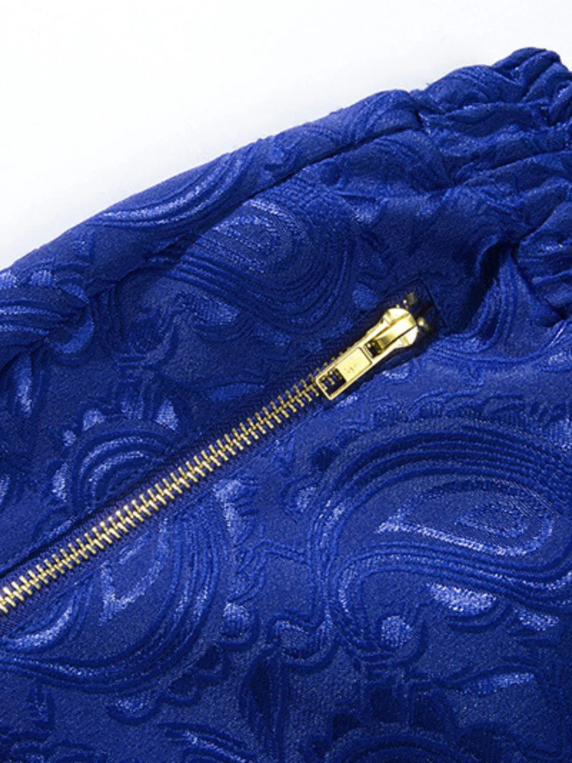 Royal blue jacquard shorts with a zip pocket detail.