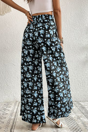 Midnight floral palazzo trousers with a black base and blue floral print.