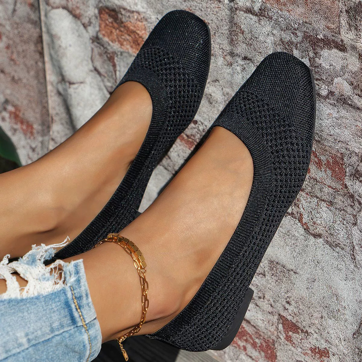 Black breathable knit square-toe flats with a textured pattern.