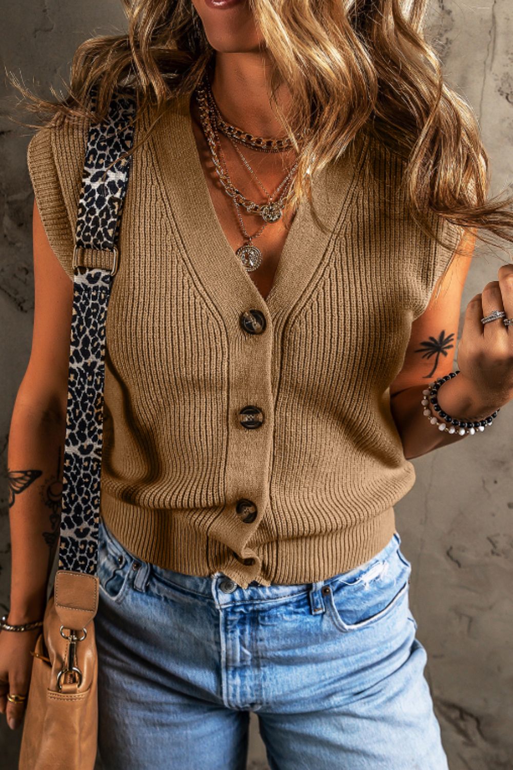 Camel ribbed button-down cardigan vest with V-neck and short sleeves.