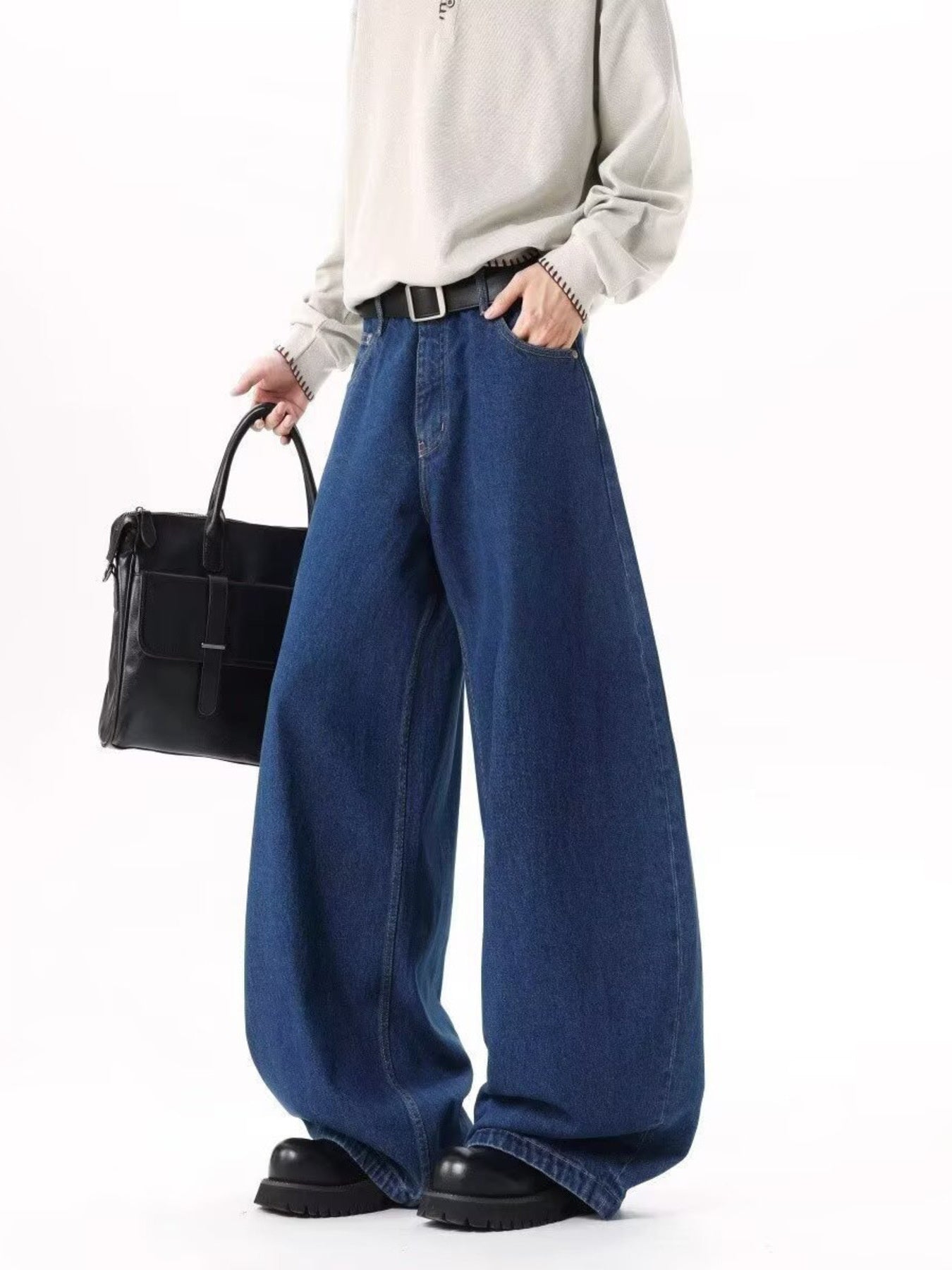 Men's dark blue wide leg jeans with contrast stitching and belt loops.