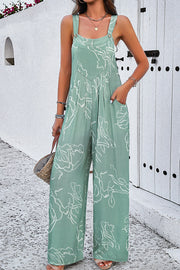 Light green abstract scribble wide leg jumpsuit with pockets and button straps