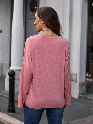 Slouchy tee in heathered pink with long sleeves and a relaxed fit.