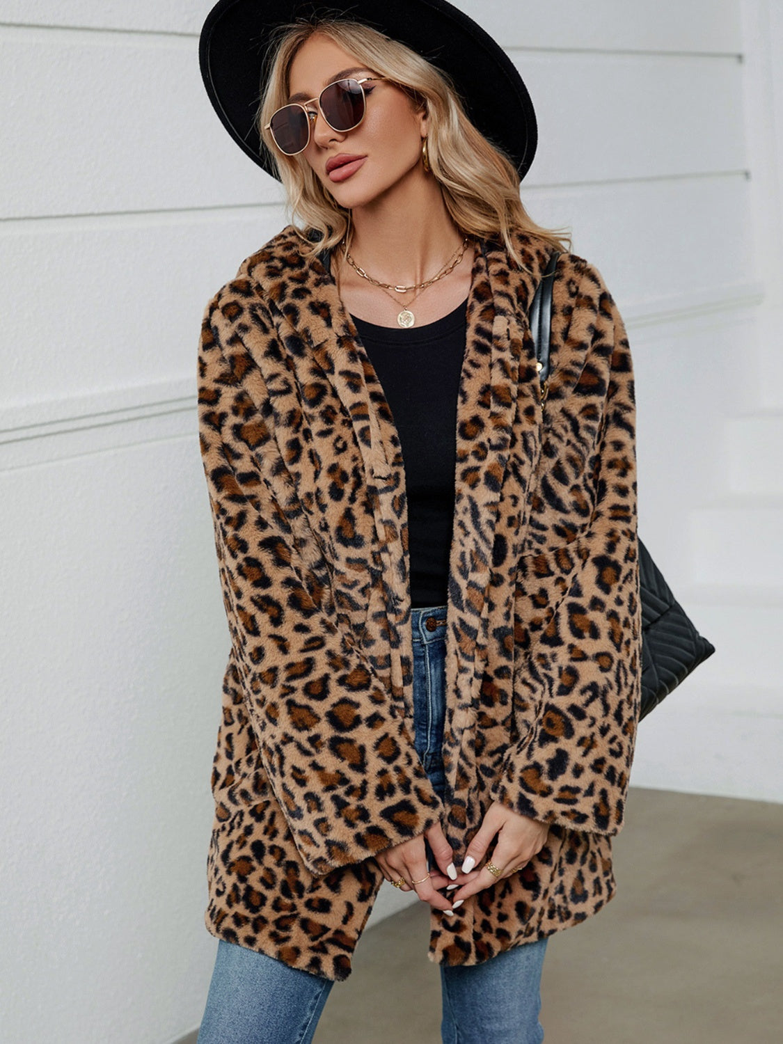 Leopard print faux fur cocoon coat with open front and relaxed fit.