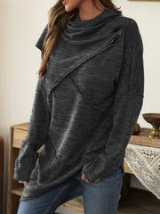 Gray asymmetric knit sweater with cowl neck and diagonal button detail.