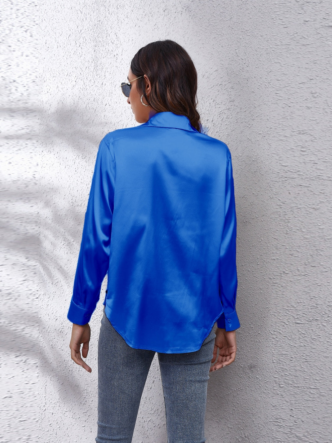 Royal blue silken button-down shirt with long sleeves and a relaxed fit.
