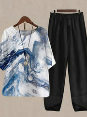 Floral print half sleeve top with black pants set.